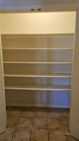 a bathroom with a toilet a sink and shower