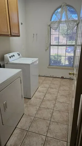 a view of a livingroom with a chandelier fan
