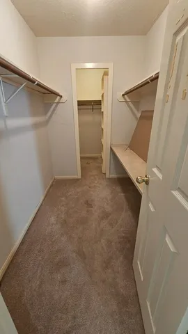 an empty room with a empty space and a ceiling fan