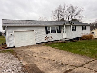 3864 School House Road Little Hocking, OH 45742 - Photo 1 of 10 Ranch-style home featuring a front lawn and a garage