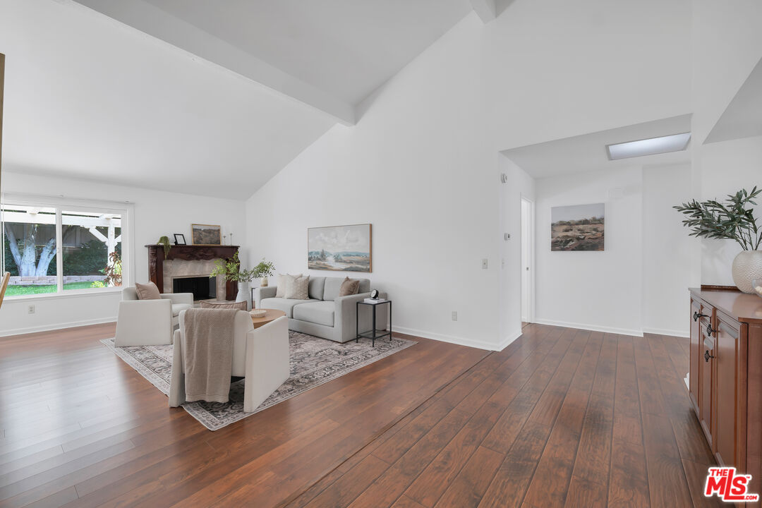 11700 Doral Avenue Porter Ranch, CA 91326 - Photo 3 of 65 a living room with furniture and a fireplace