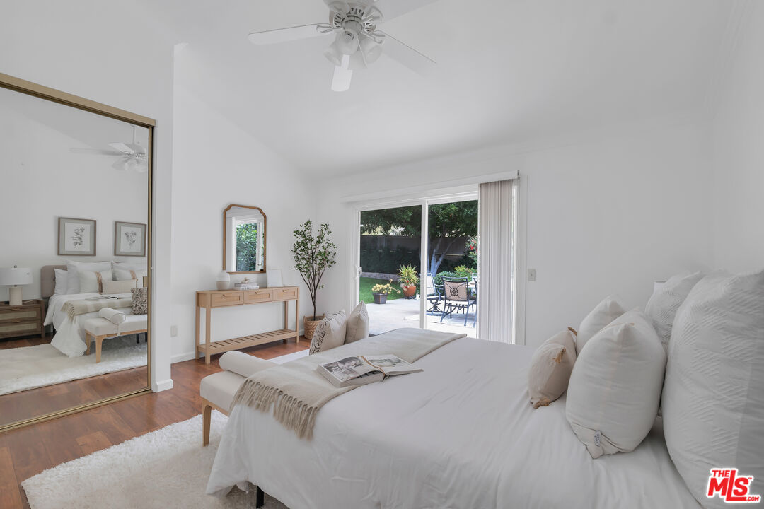 11700 Doral Avenue Porter Ranch, CA 91326 - Photo 36 of 65 a bedroom with a bed and a chandelier