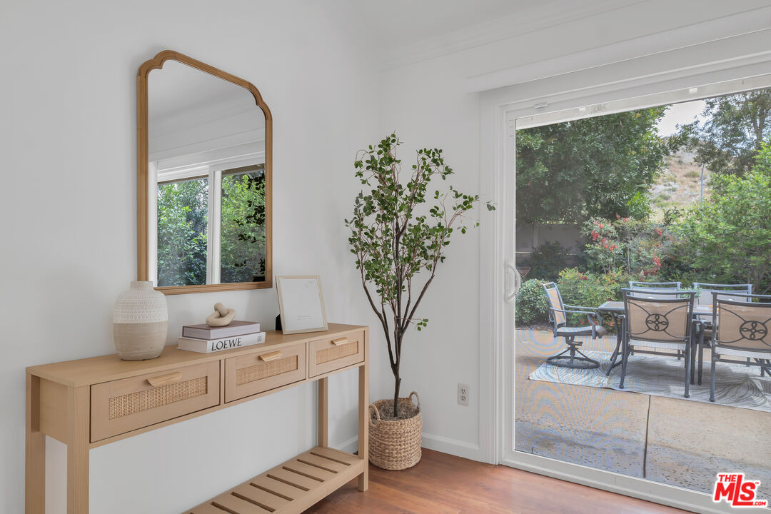 11700 Doral Avenue Porter Ranch, CA 91326 - Photo 41 of 65 a living room with furniture and a potted plant