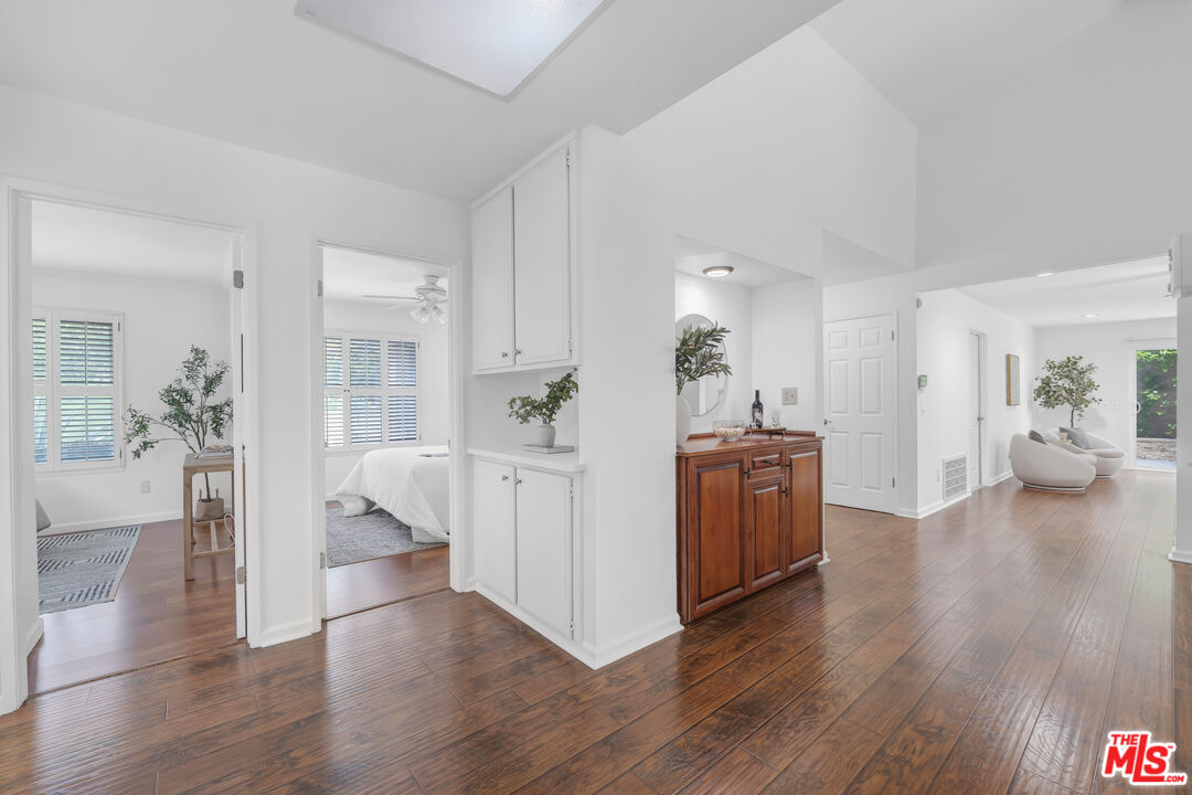 11700 Doral Avenue Porter Ranch, CA 91326 - Photo 42 of 65 a view of a kitchen and dining room with wooden floor
