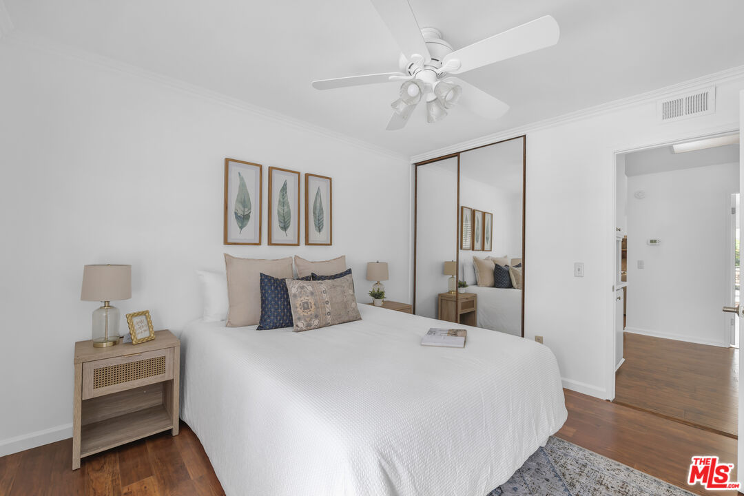 11700 Doral Avenue Porter Ranch, CA 91326 - Photo 46 of 65 a bedroom with a bed and a chandelier