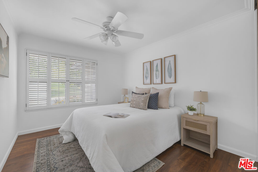 11700 Doral Avenue Porter Ranch, CA 91326 - Photo 48 of 65 a bedroom with a bed and a window