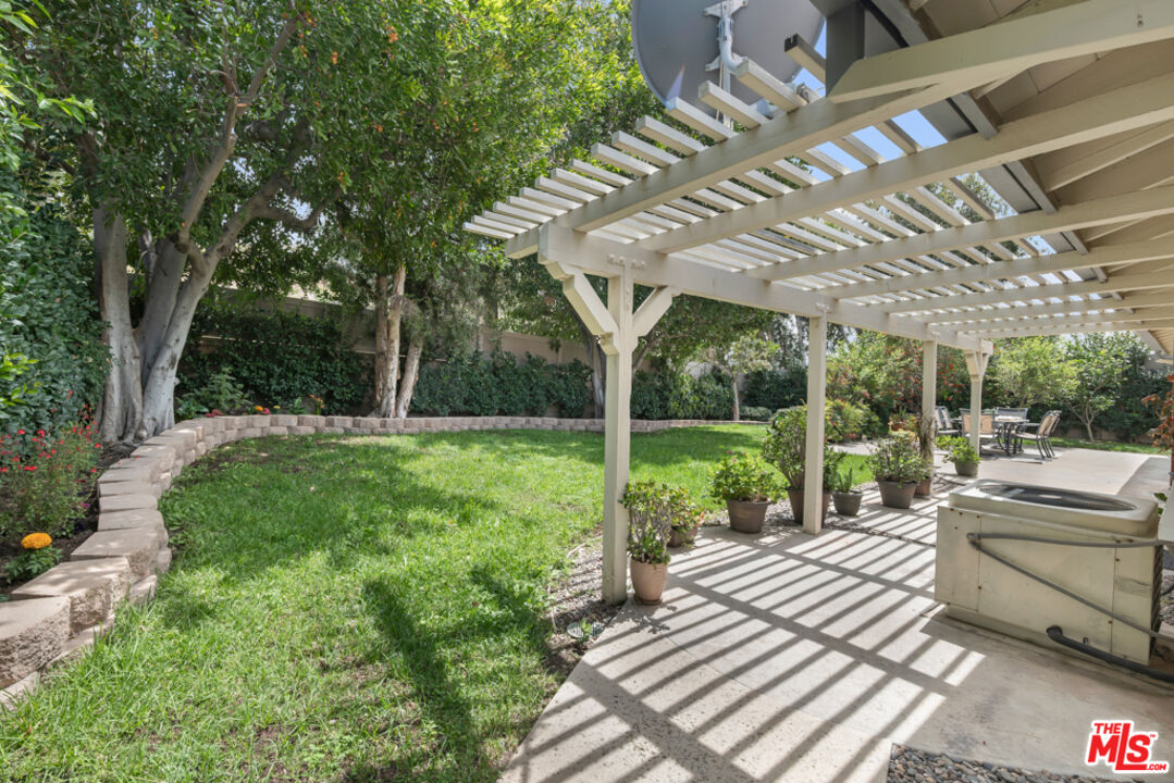 11700 Doral Avenue Porter Ranch, CA 91326 - Photo 50 of 65 a view of a backyard with sitting area and furniture