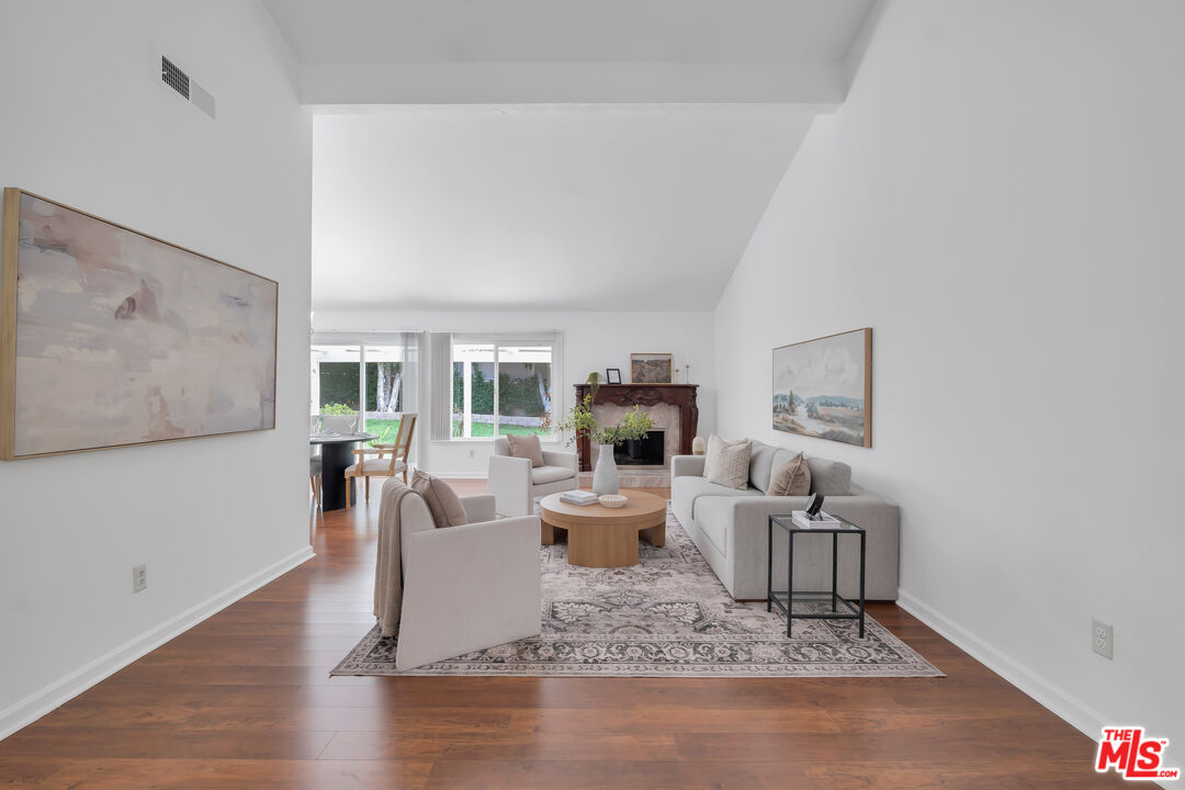 11700 Doral Avenue Porter Ranch, CA 91326 - Photo 6 of 65 a living room with furniture and a table
