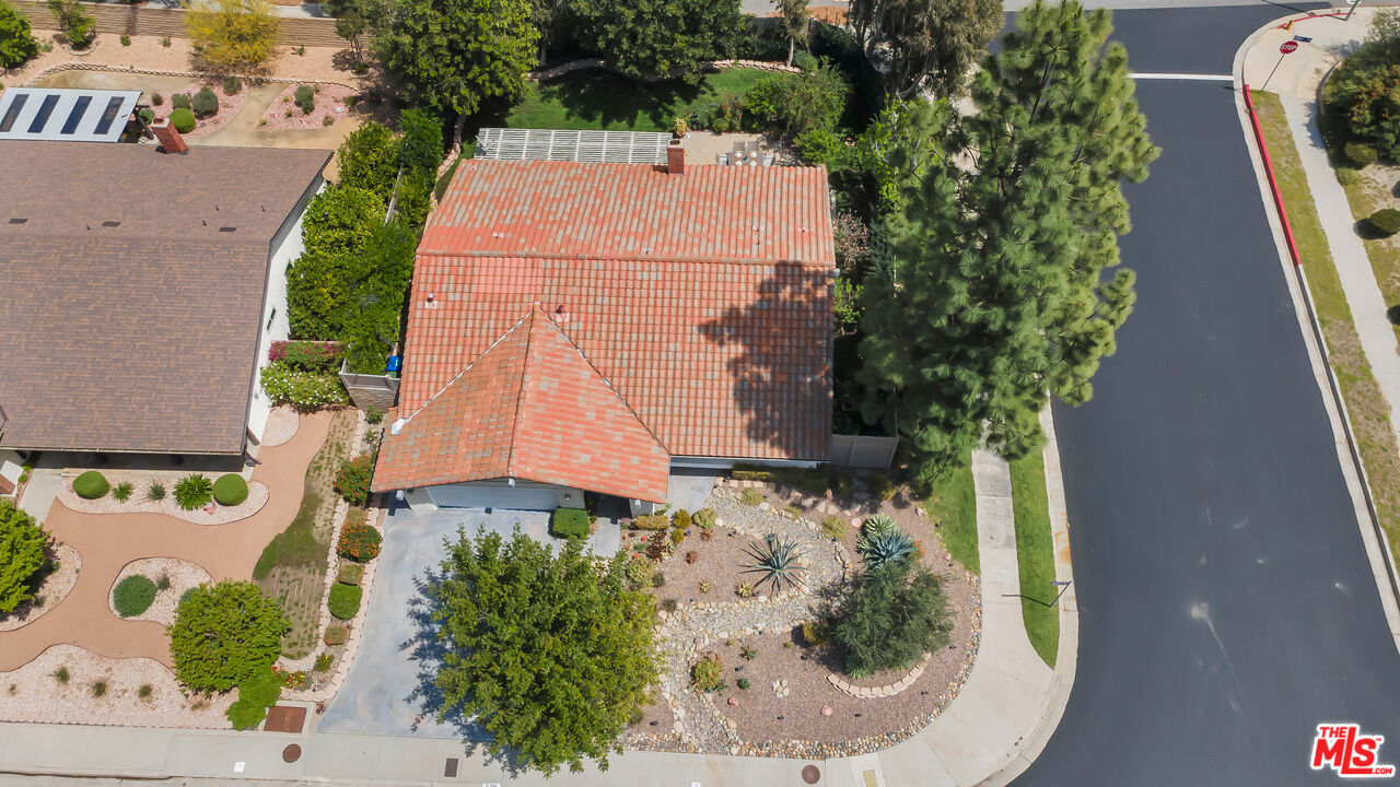 11700 Doral Avenue Porter Ranch, CA 91326 - Photo 61 of 65 an aerial view of a house with a yard and garden