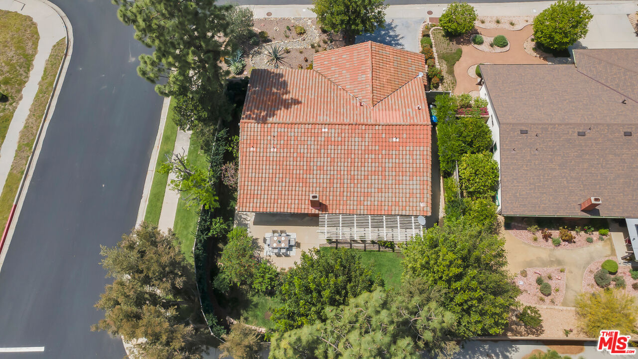 11700 Doral Avenue Porter Ranch, CA 91326 - Photo 64 of 65 an aerial view of a house with a yard and garden