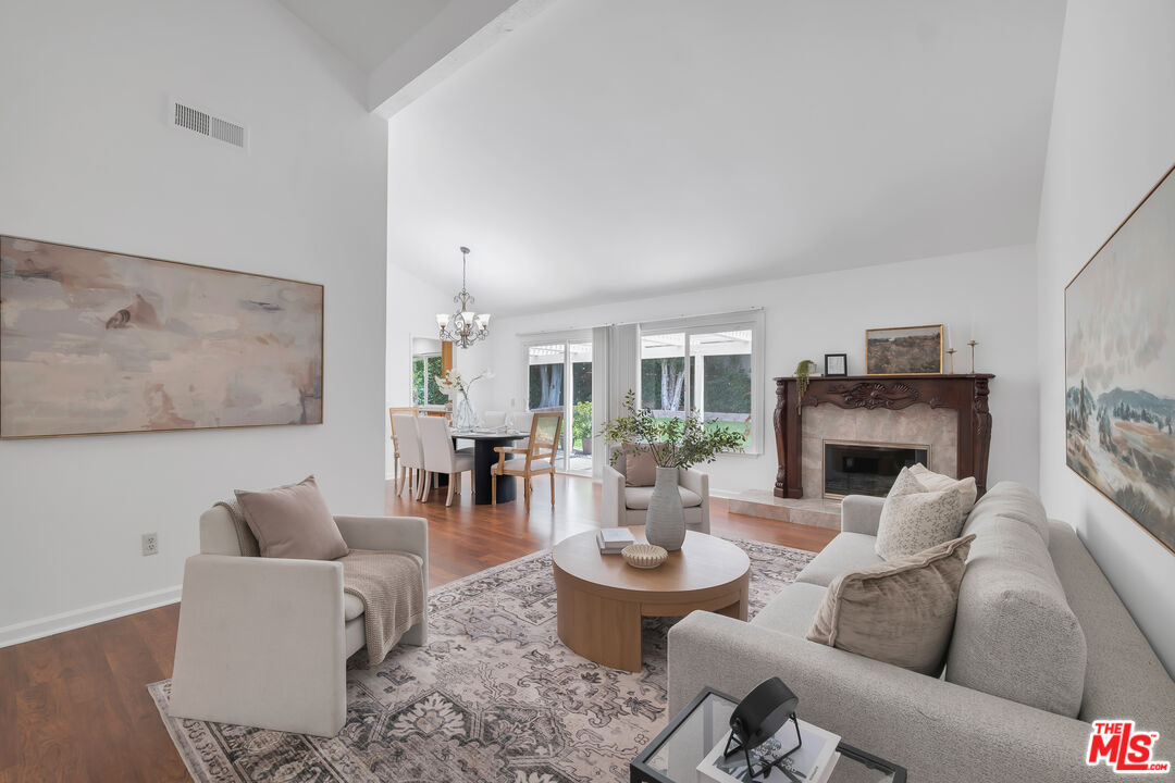 11700 Doral Avenue Porter Ranch, CA 91326 - Photo 7 of 65 a living room with furniture and a fireplace