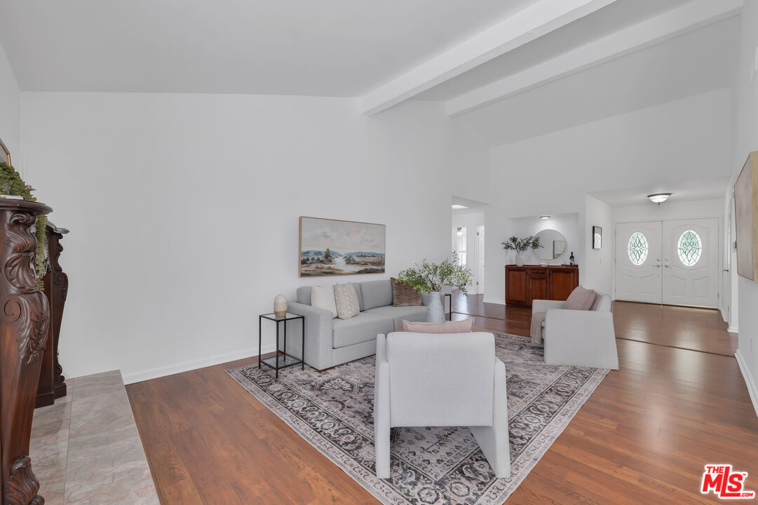 11700 Doral Avenue Porter Ranch, CA 91326 - Photo 10 of 65 a living room with furniture and a table
