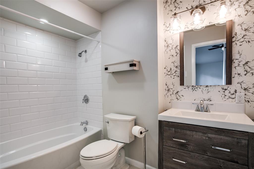 2012 Custer Parkway Richardson, TX 75080 - Photo 12 of 12 a bathroom with a sink toilet vanity and shower