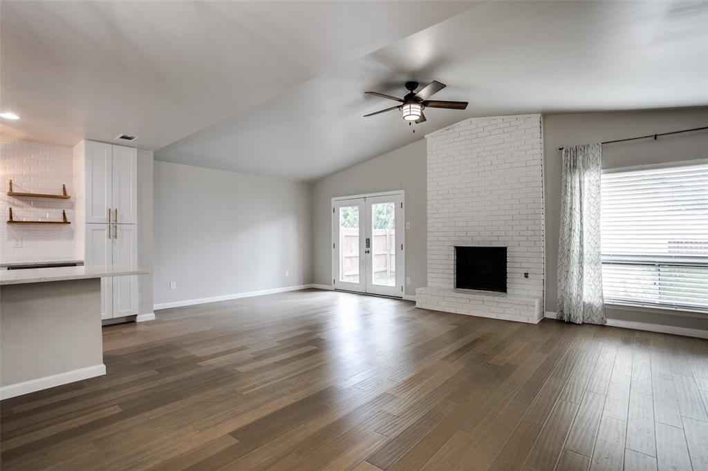 2012 Custer Parkway Richardson, TX 75080 - Photo 4 of 12 a view of empty room with wooden floor and fireplace
