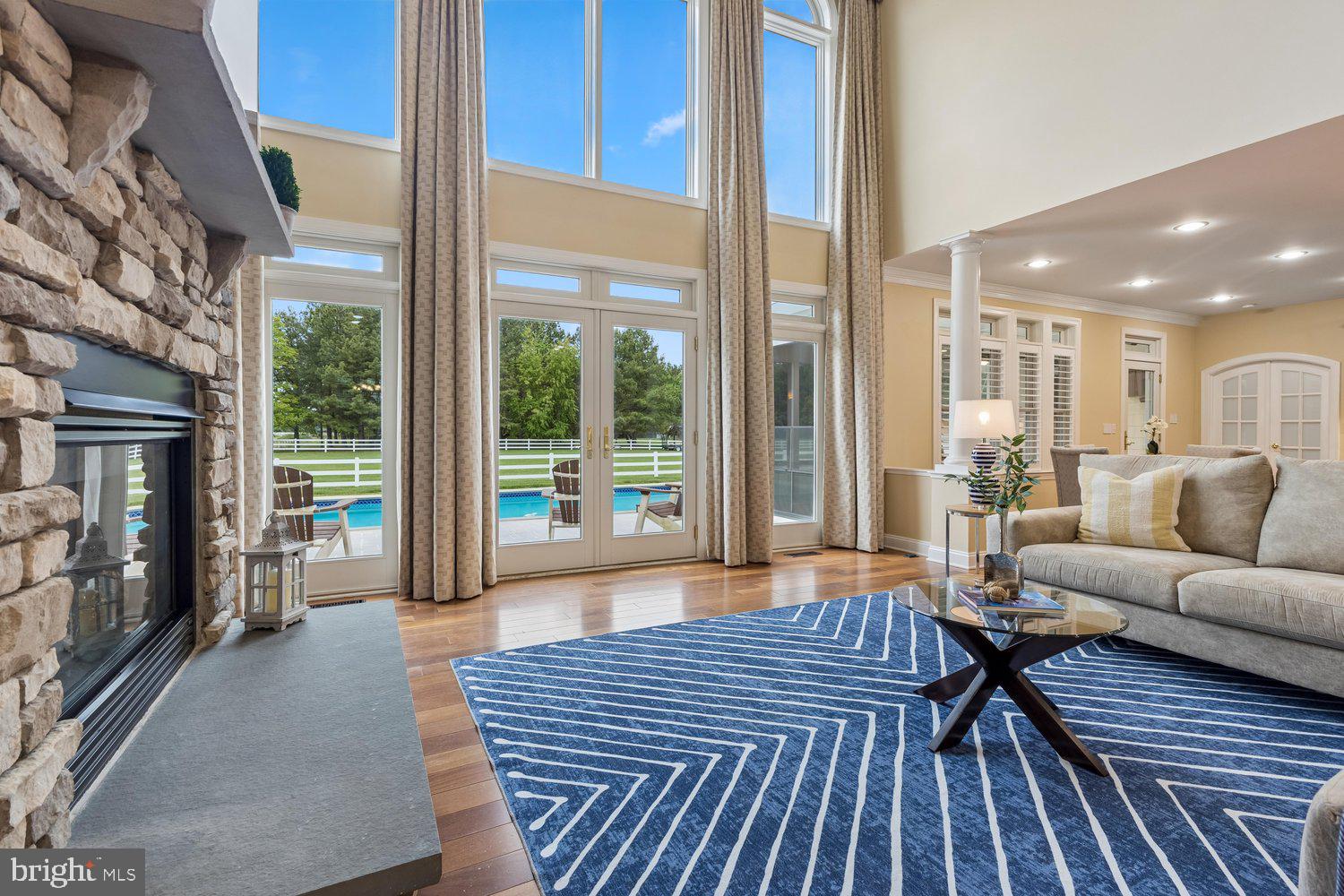 313 Wye Road Queenstown, MD 21658 - Photo 34 of 132 Bright and airy living space with pool view.