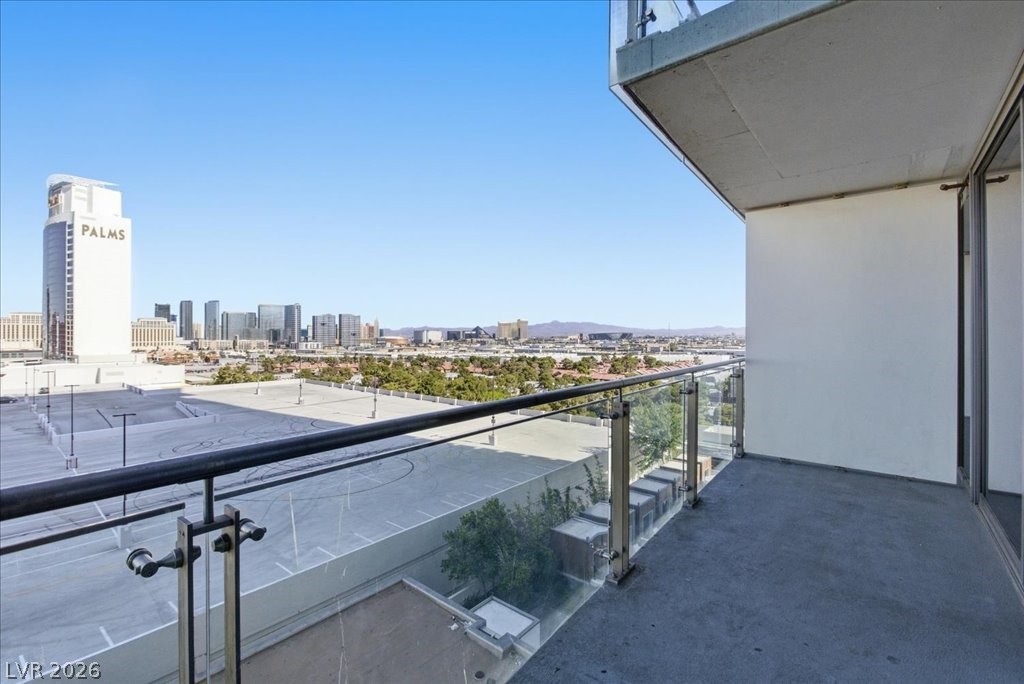 4381 West Flamingo Road, Unit 10306 Las Vegas, NV 89103 - Photo 20 of 26 This spacious outdoor balcony provides sweeping urban views and ample room for relaxation.
