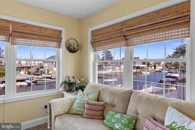 a view of a chairs and table in the balcony