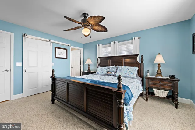 a view of walk in closet with clothes