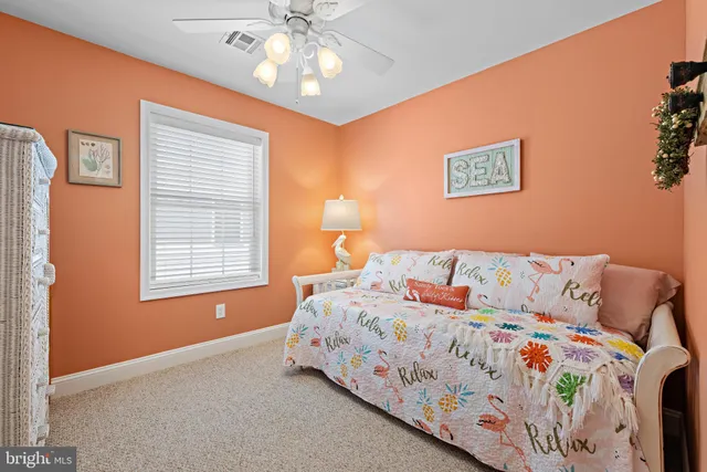 a view of a dining room with furniture and a chandelier