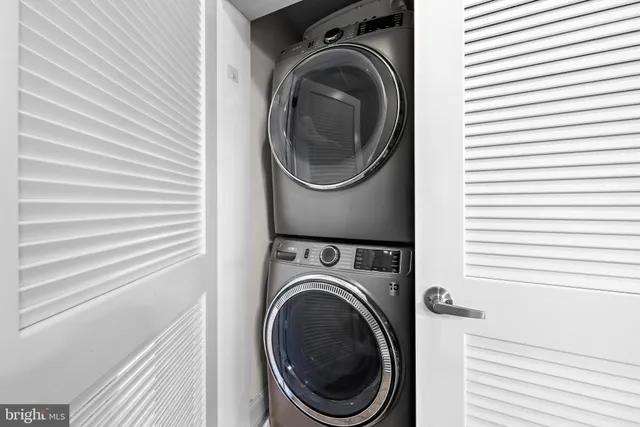 a view of a dining room with furniture and window