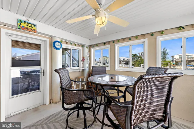 a view of residential houses with outdoor space and seating