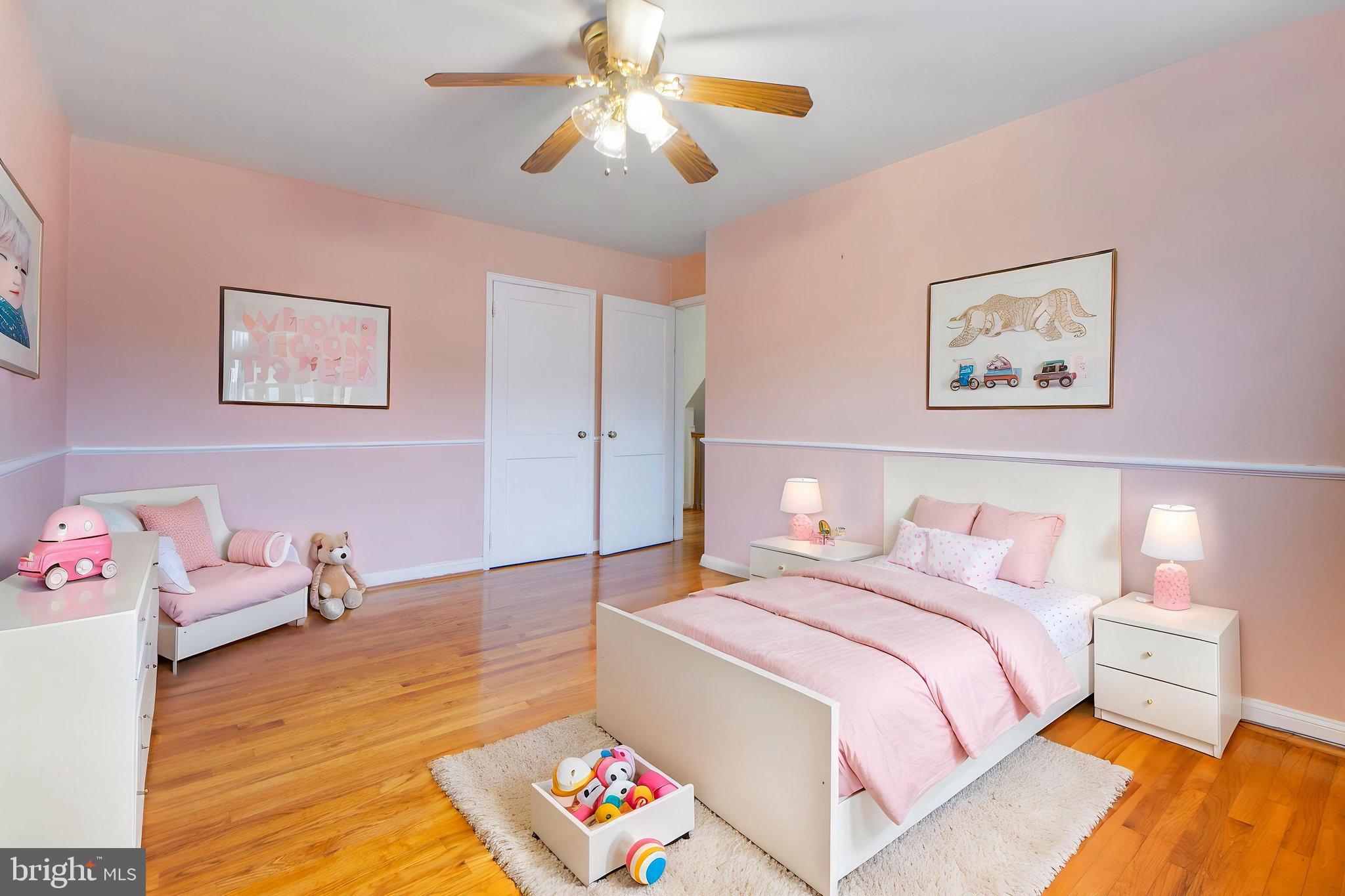 1903 Heathfield Road Baltimore, MD 21239 - Photo 15 of 30 a bedroom with a bed and wooden floor