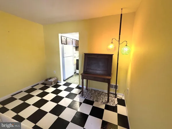 a view of a storage & utility room with a sink