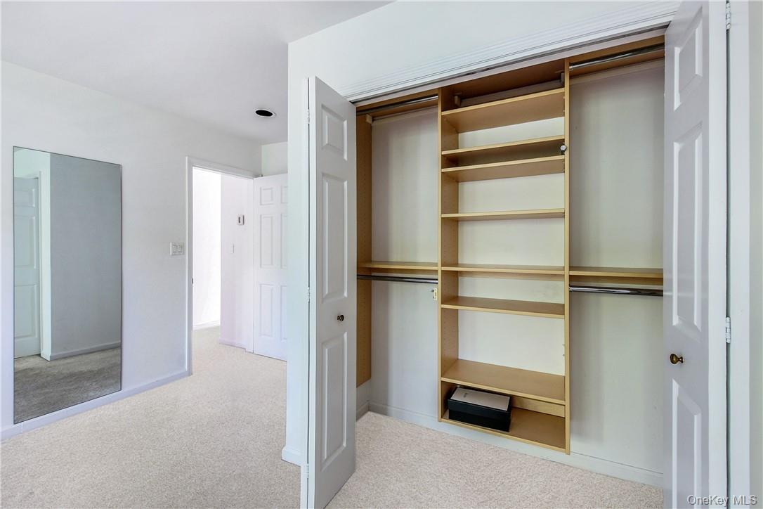 599 Midland Avenue, Unit 25 Rye, NY 10580 - Photo 16 of 25 Primary bedroom closet with organizer