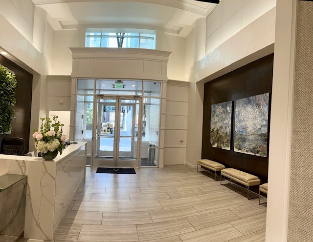 415 Church Street, Unit 1603 Nashville, TN 37219 - Photo 2 of 14 a living room with furniture large window and a rug