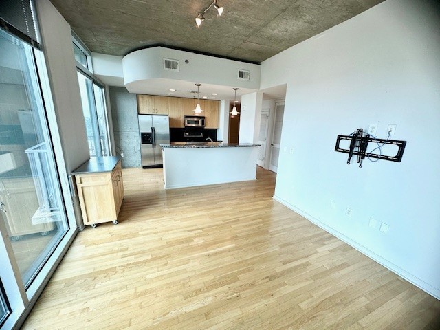 415 Church Street, Unit 1603 Nashville, TN 37219 - Photo 6 of 14 a view of a living room with a flat screen tv