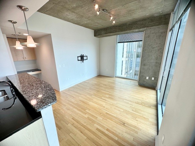 415 Church Street, Unit 1603 Nashville, TN 37219 - Photo 7 of 14 a bedroom with a bed and a dresser