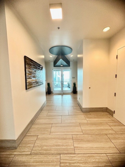 415 Church Street, Unit 1603 Nashville, TN 37219 - Photo 10 of 14 a view of an empty room with window and wooden floor