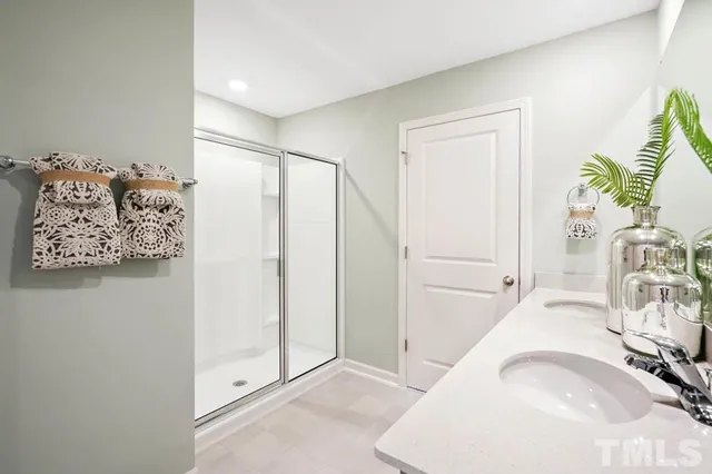 a view of a livingroom with wooden floor and a bedroom