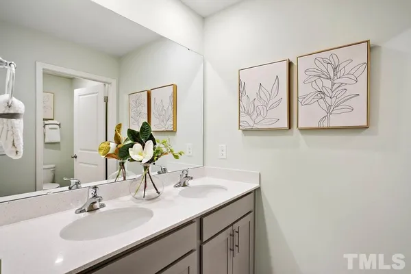 a bedroom with a bed and a chair