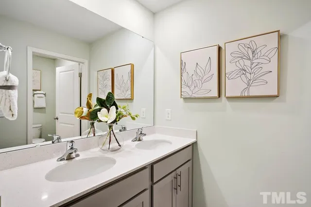 a bedroom with a bed and a chair