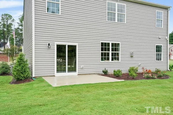 a front view of a house with a yard and porch