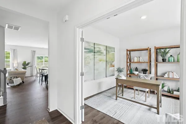 a living room with furniture and a table
