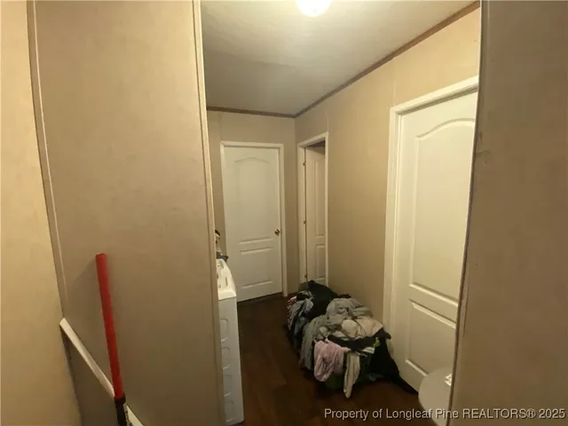 a room with a wooden floor and a sink