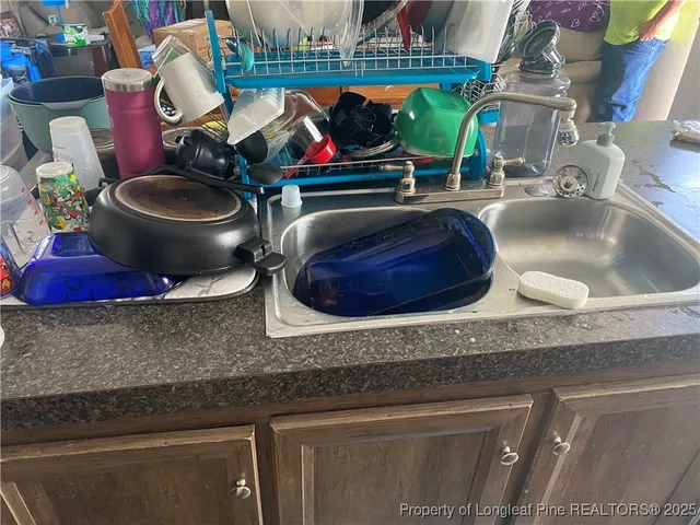 a bathroom with a sink and mirror