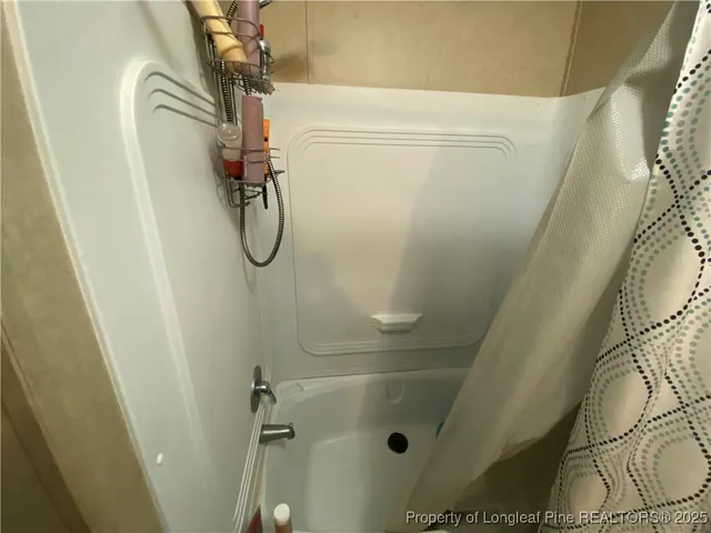 a bathroom with a glass shower door