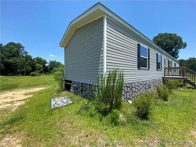 a house view with a garden space