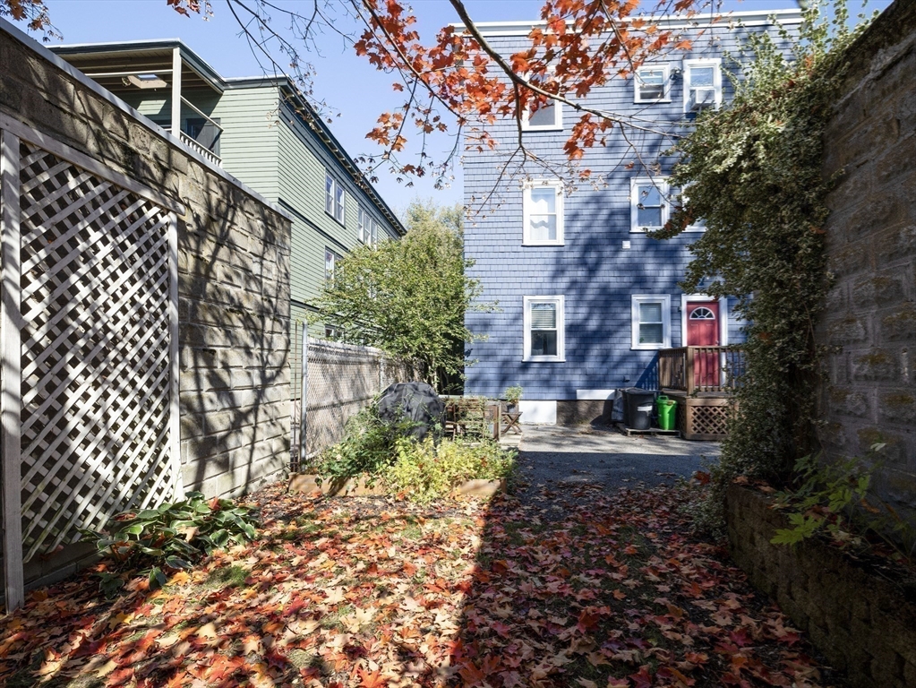 91-93 Rossmore Road, Unit 3 Boston, MA 02130 - Photo 24 of 25 a pathway of a house with a yard