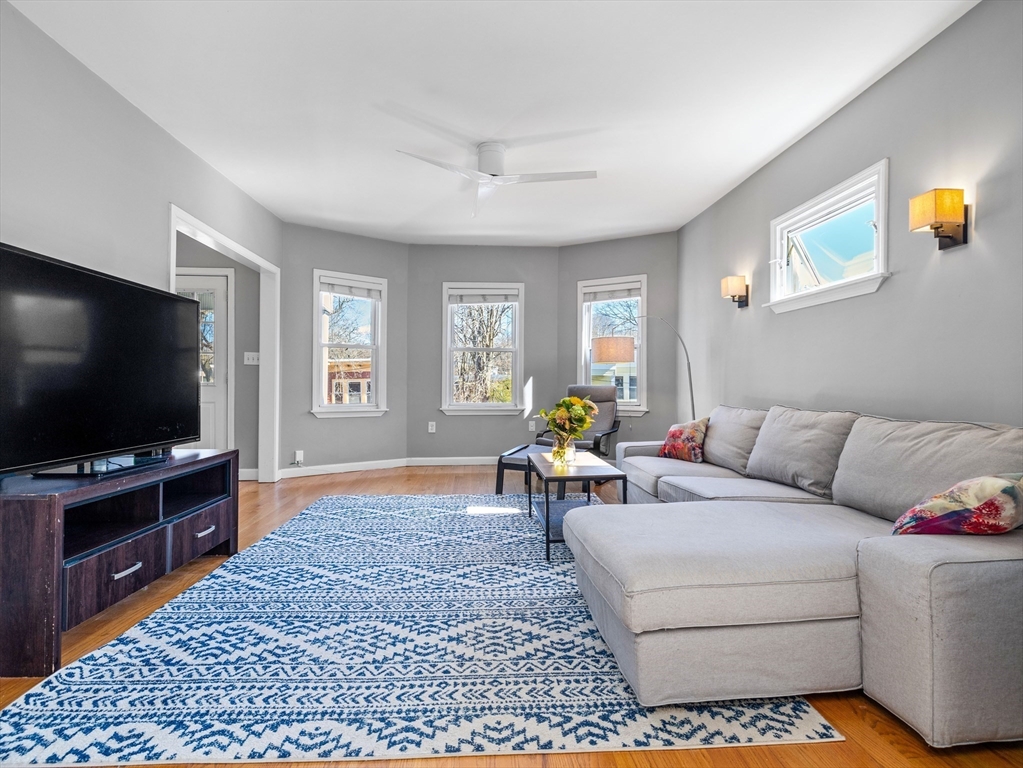 91-93 Rossmore Road, Unit 3 Boston, MA 02130 - Photo 3 of 25 a living room with furniture and a flat screen tv