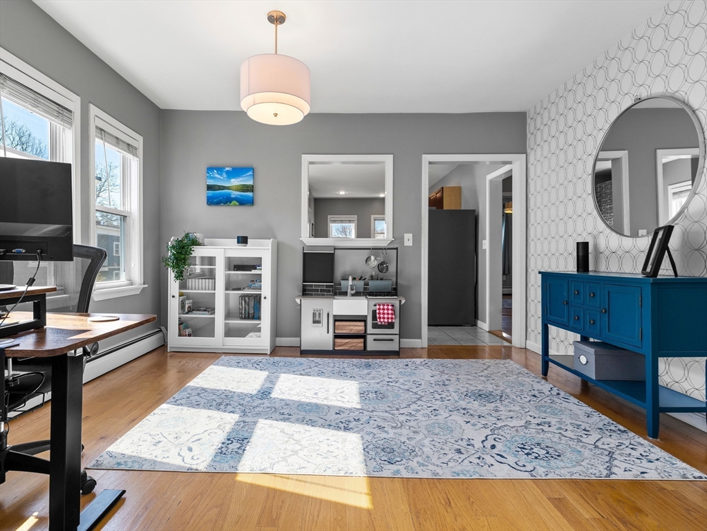 91-93 Rossmore Road, Unit 3 Boston, MA 02130 - Photo 5 of 25 a living room with furniture and a flat screen tv