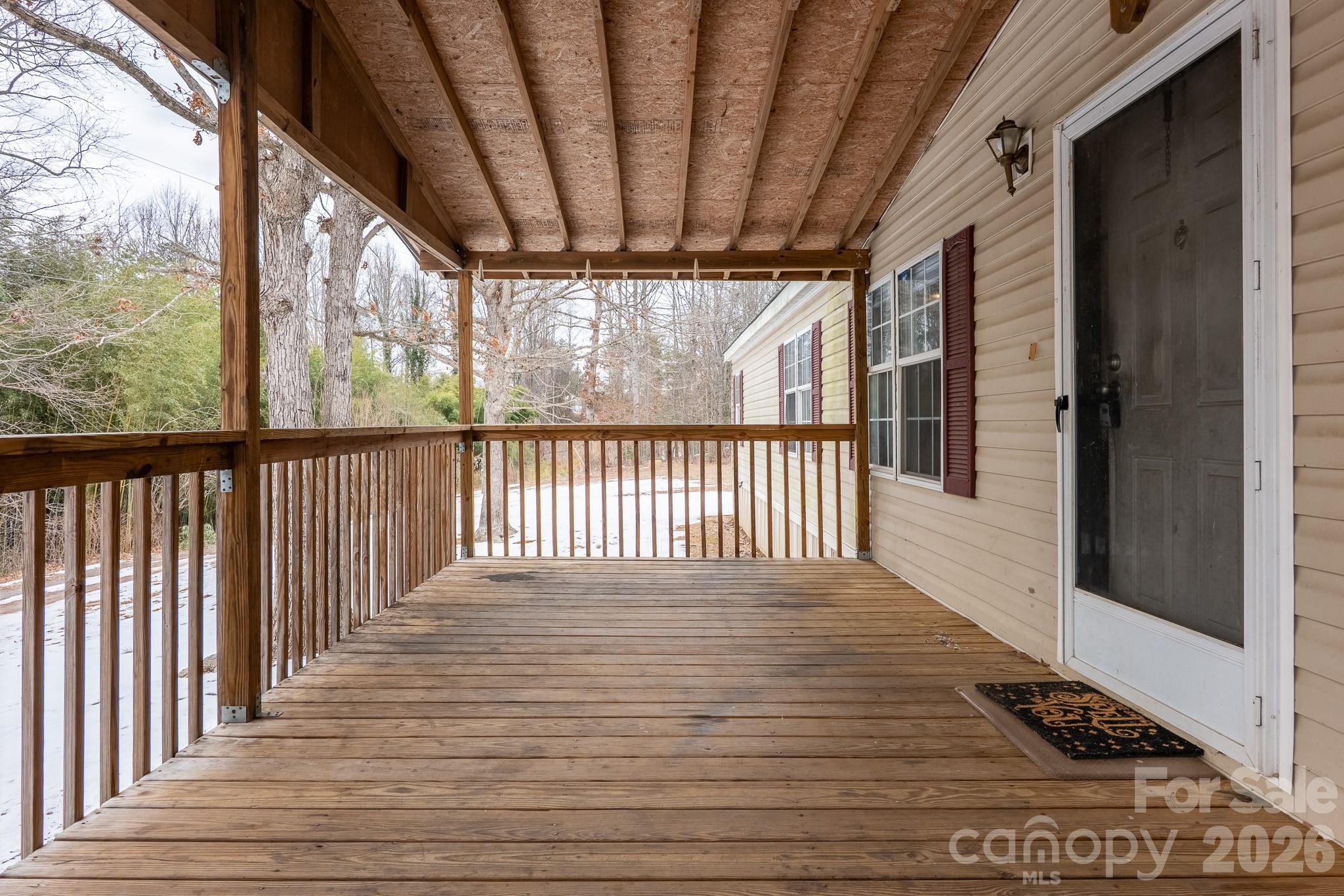 8636 County Line Road Hickory, NC 28602 - Photo 2 of 18 a view of a porch with wooden floor