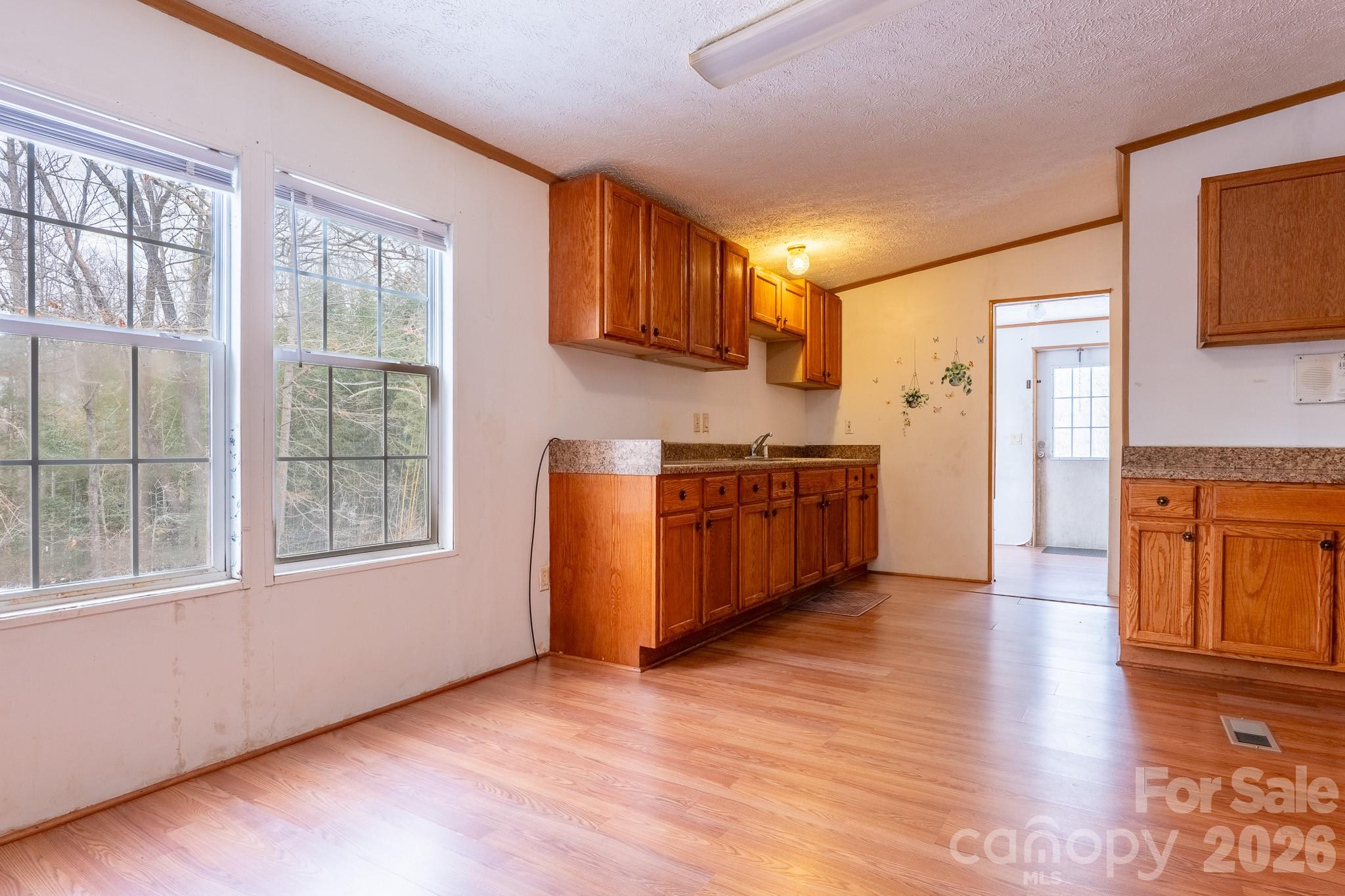 8636 County Line Road Hickory, NC 28602 - Photo 7 of 18 a kitchen with stainless steel appliances granite countertop a stove a sink and a refrigerator
