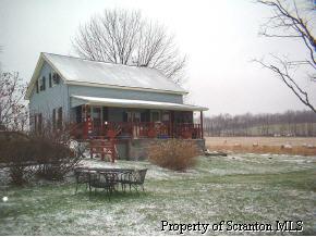 69 Dean Road Meshoppen, PA 18630 - Photo 1 of 1 a view of a house with a yard balcony and sitting area