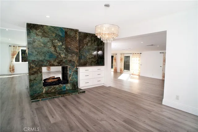 a view of a living room and hardwood floor