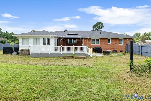 a front view of a house with a yard table and chairs