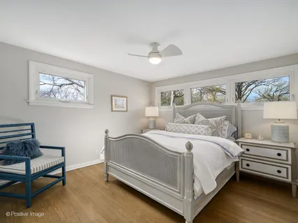 a bed room with a bed and a night stand
